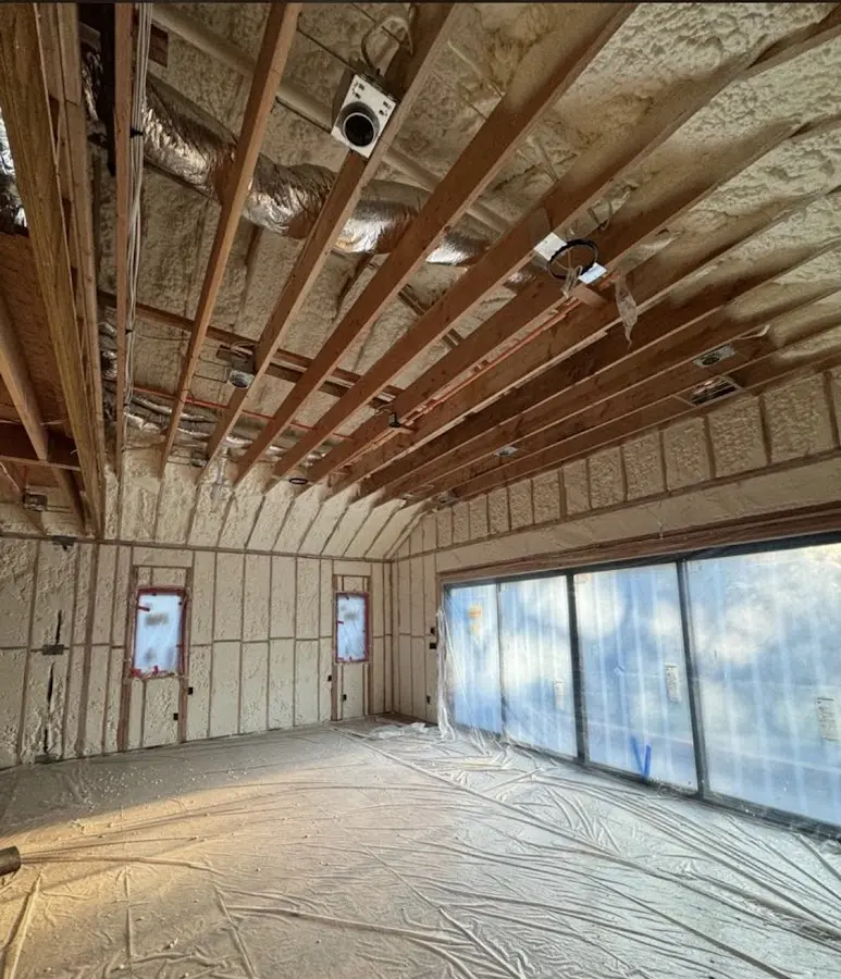 Interior walls and ceiling insulated with spray foam during new construction in Roy